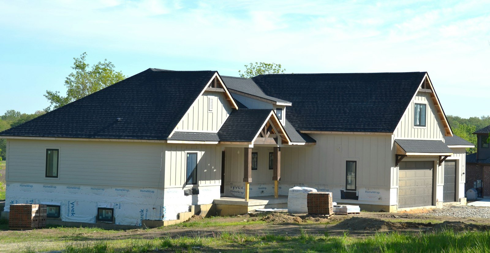 New home with a dark architectural shingle roof in Huntsville, AL